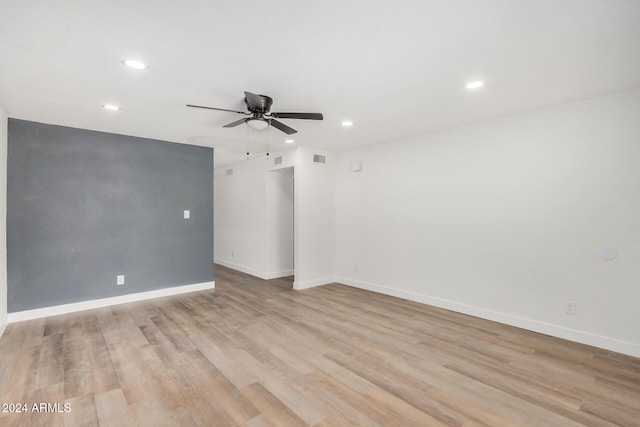 empty room featuring ceiling fan and light wood-type flooring