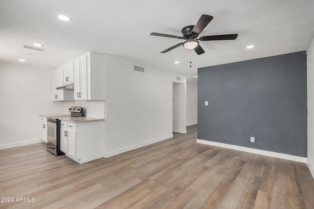 unfurnished living room featuring light hardwood / wood-style flooring and ceiling fan