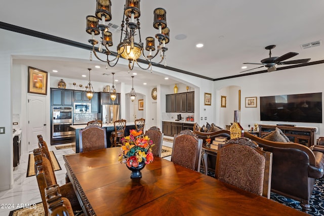 dining room with ceiling fan and ornamental molding