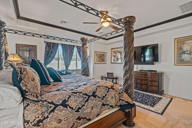 carpeted bedroom featuring ceiling fan and ornamental molding