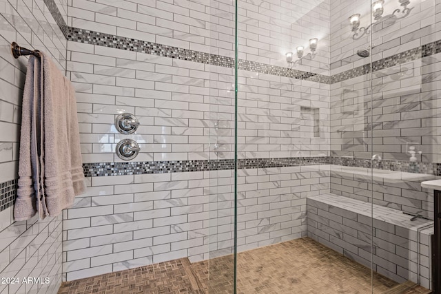 bathroom featuring a tile shower