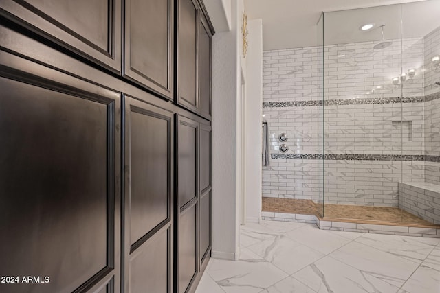 bathroom with a tile shower