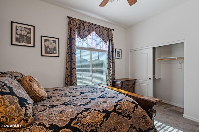 carpeted bedroom with ceiling fan and a closet