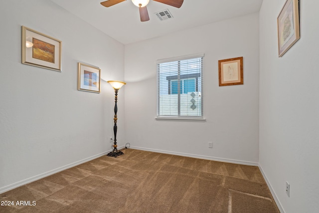 spare room with carpet and ceiling fan