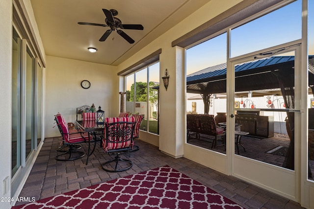 sunroom / solarium with ceiling fan