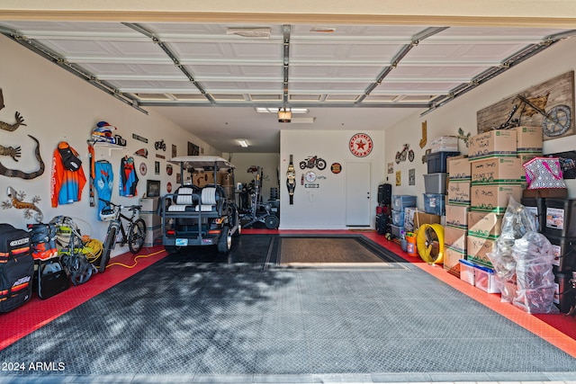 garage featuring a garage door opener