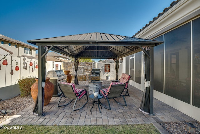 view of patio with a gazebo and a grill