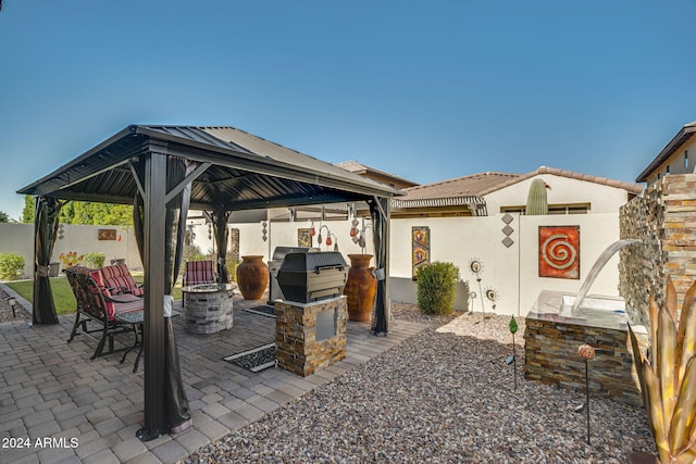 view of patio with a gazebo and a grill