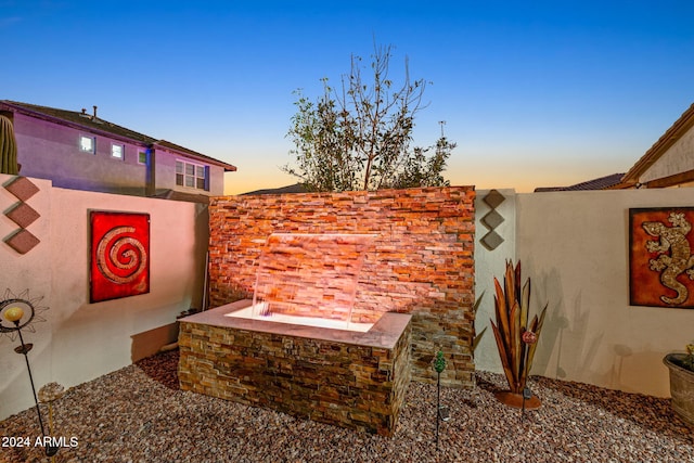 view of patio terrace at dusk