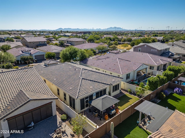 birds eye view of property with a mountain view