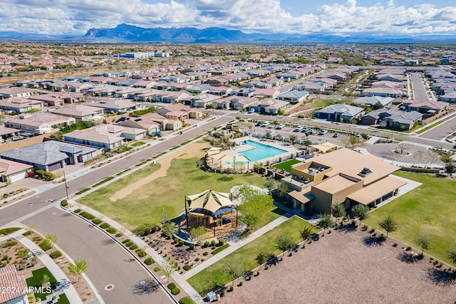 birds eye view of property with a mountain view