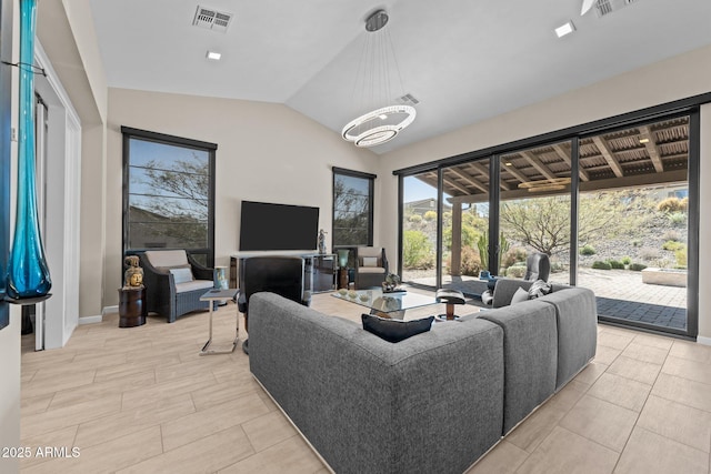 4093 Miners Gulch Way, Wickenburg, AZ 85390 - living room with lofted ceiling, visible vents, and a notable chandelier