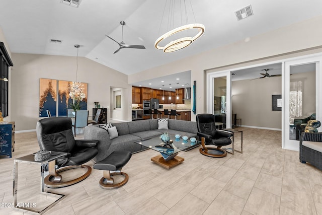 4093 Miners Gulch Way, Wickenburg, AZ 85390 - living room with ceiling fan with notable chandelier, visible vents, and vaulted ceiling