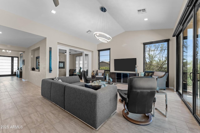4093 Miners Gulch Way, Wickenburg, AZ 85390 - living room with lofted ceiling, visible vents, and a chandelier