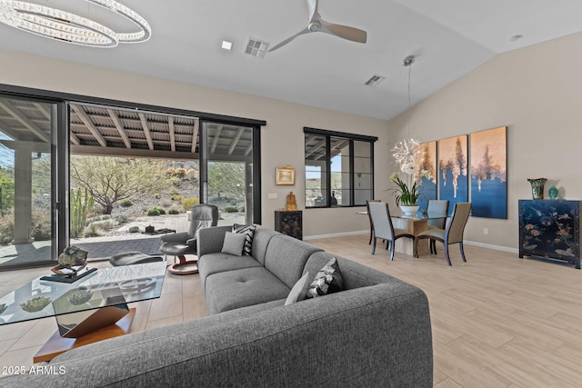 4093 Miners Gulch Way, Wickenburg, AZ 85390 - living room with baseboards, lofted ceiling, visible vents, and ceiling fan with notable chandelier
