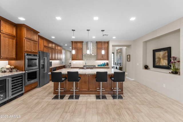 4093 Miners Gulch Way, Wickenburg, AZ 85390 - kitchen featuring backsplash, wall chimney exhaust hood, stainless steel double oven, high end black fridge, and brown cabinetry