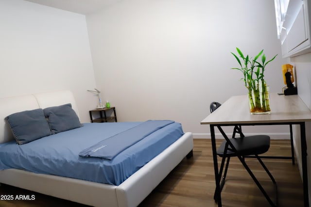 bedroom featuring hardwood / wood-style flooring