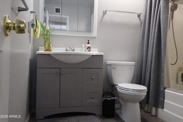 full bathroom with vanity, toilet, and shower / bath combo with shower curtain