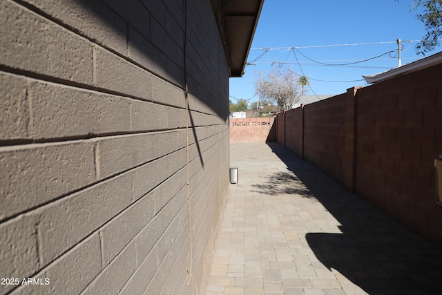 view of side of property featuring a patio