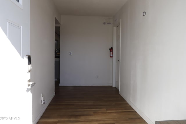 hallway featuring dark wood-type flooring