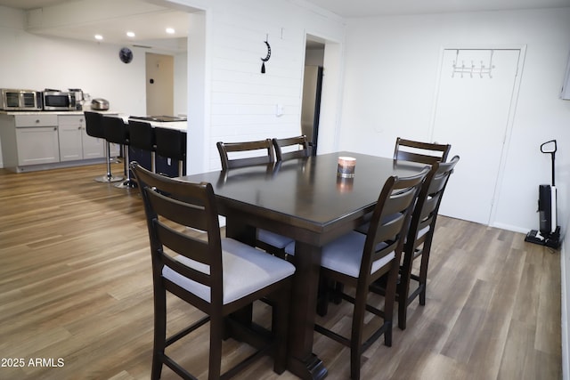 dining area with hardwood / wood-style flooring