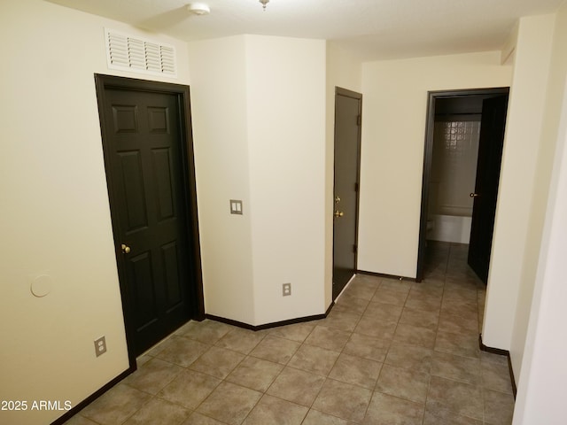 43241 W Kristal Ln, Maricopa, AZ 85138 - unfurnished bedroom with baseboards and light tile patterned floors