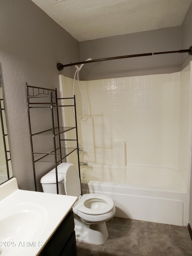 43241 W Kristal Ln, Maricopa, AZ 85138 - bathroom with vanity, shower / bath combination, toilet, tile patterned floors, and a textured wall