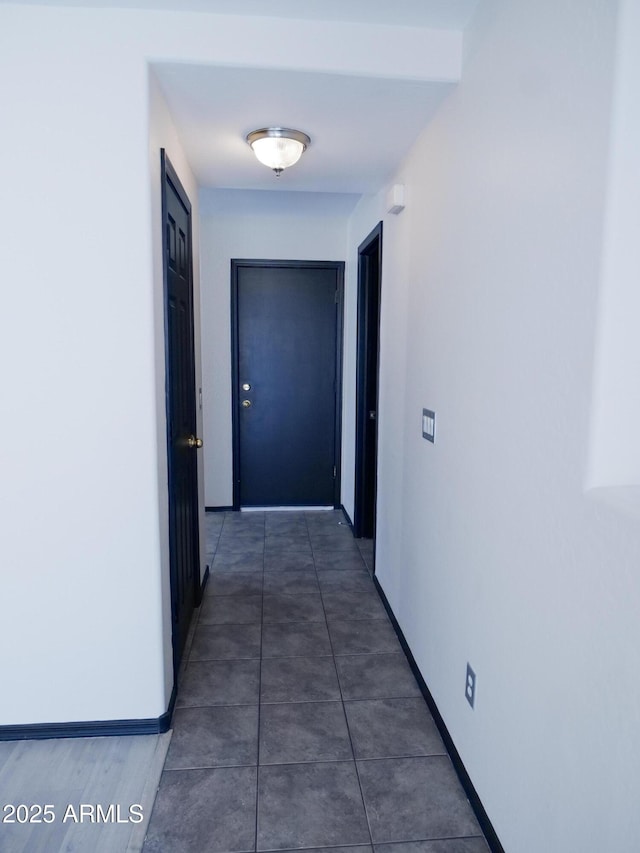 43241 W Kristal Ln, Maricopa, AZ 85138 - corridor with baseboards and tile patterned floors