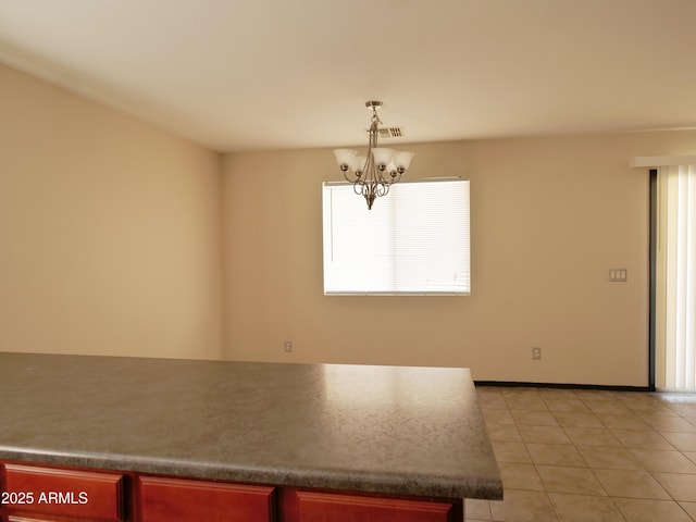 43241 W Kristal Ln, Maricopa, AZ 85138 - unfurnished dining area with a chandelier, healthy amount of natural light, light tile patterned flooring, and baseboards