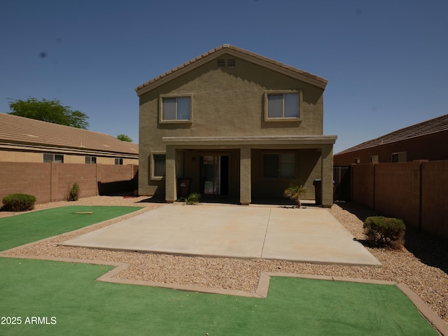 43241 W Kristal Ln, Maricopa, AZ 85138 - rear view of house featuring a fenced backyard, stucco siding, and a patio