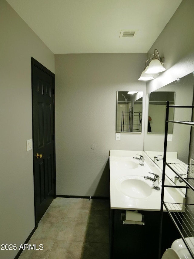 43241 W Kristal Ln, Maricopa, AZ 85138 - bathroom with double vanity and baseboards