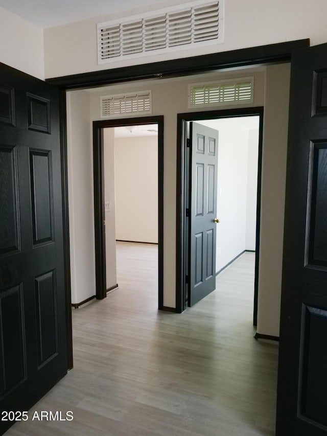43241 W Kristal Ln, Maricopa, AZ 85138 - hall with light wood-type flooring and baseboards