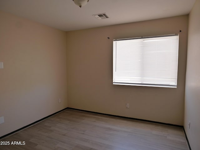 43241 W Kristal Ln, Maricopa, AZ 85138 - unfurnished room with wood finished floors and baseboards