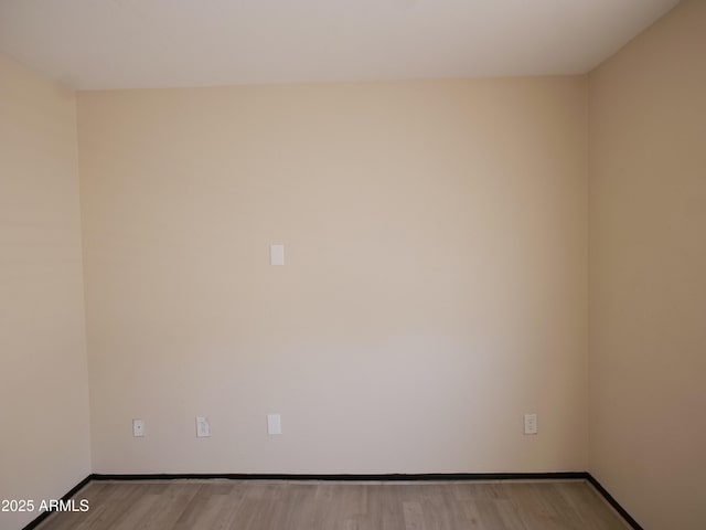 43241 W Kristal Ln, Maricopa, AZ 85138 - spare room with wood finished floors and baseboards