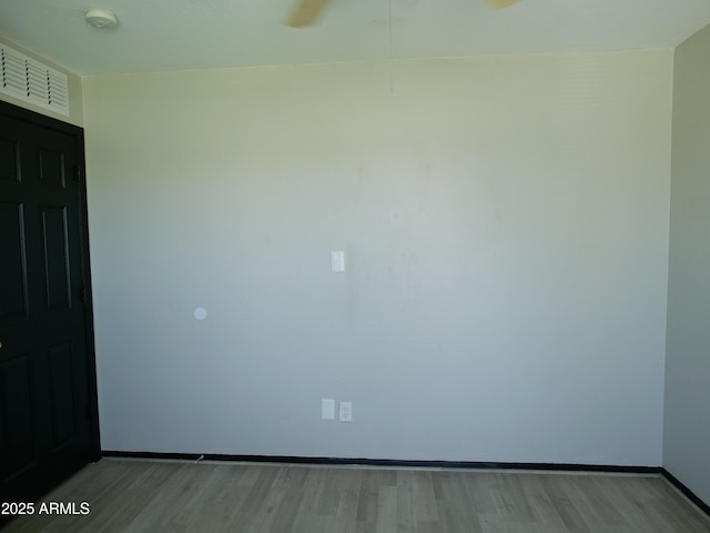 43241 W Kristal Ln, Maricopa, AZ 85138 - spare room featuring a smoke detector, light wood-style flooring, a ceiling fan, and baseboards
