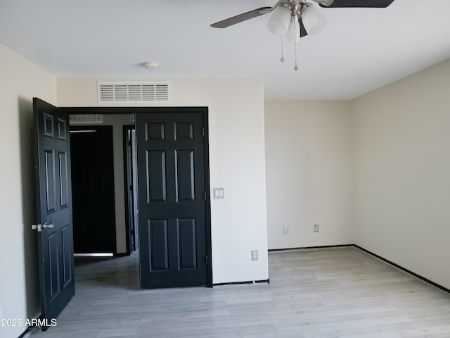 43241 W Kristal Ln, Maricopa, AZ 85138 - empty room featuring a ceiling fan, wood finished floors, and a smoke detector