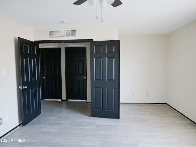 43241 W Kristal Ln, Maricopa, AZ 85138 - foyer with ceiling fan, wood finished floors, and baseboards