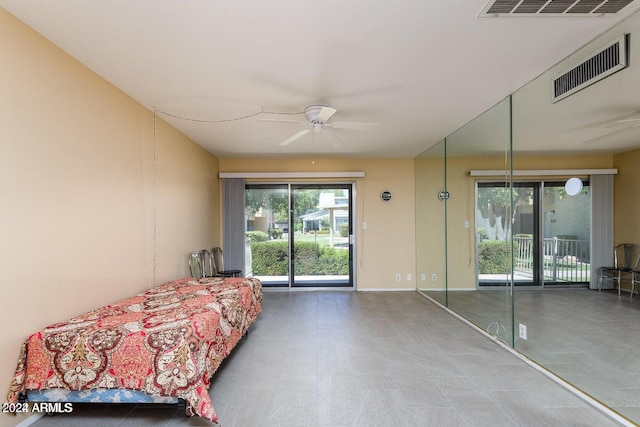 unfurnished bedroom featuring ceiling fan and access to exterior