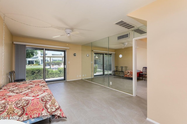 unfurnished bedroom with access to outside and ceiling fan