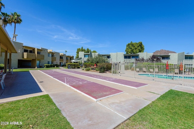 view of home's community featuring a pool