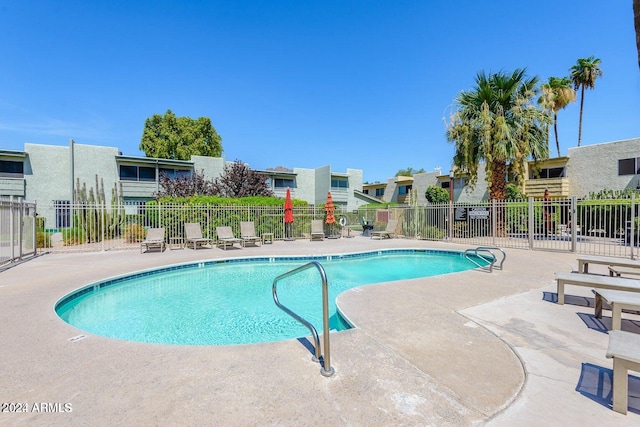 view of swimming pool featuring a patio area