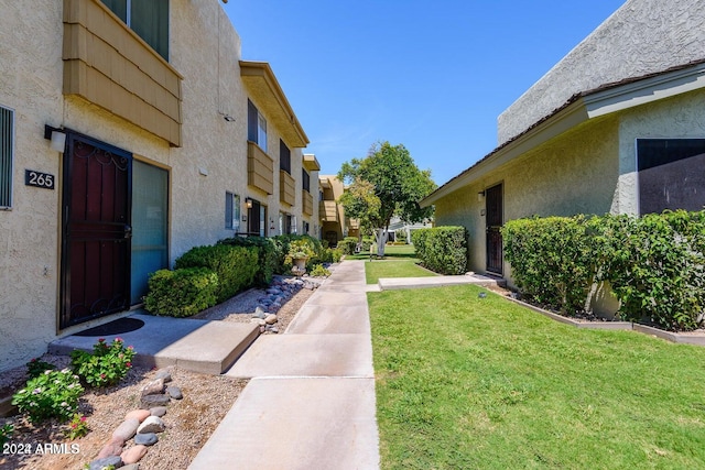 view of home's community featuring a yard