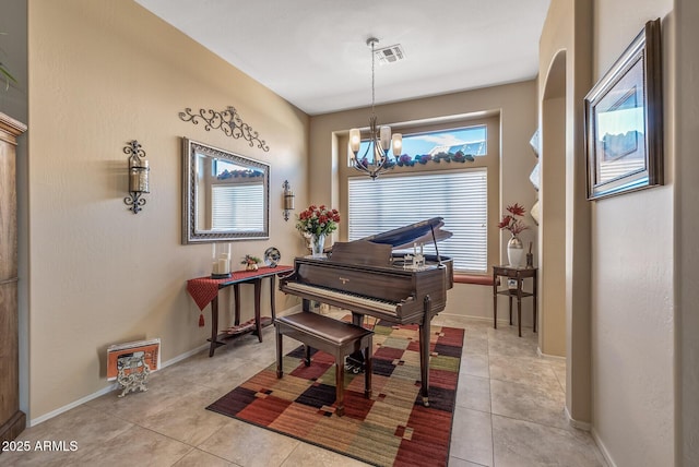 living area with light tile patterned floors, baseboards, and visible vents