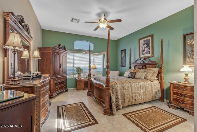 bedroom with a ceiling fan, visible vents, and light tile patterned floors