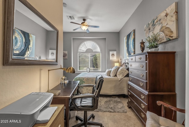 home office featuring light tile patterned floors, ceiling fan, and visible vents