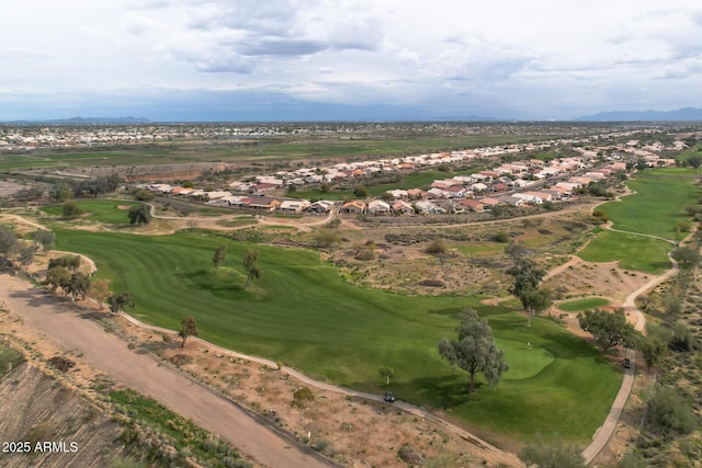 drone / aerial view featuring view of golf course and a mountain view