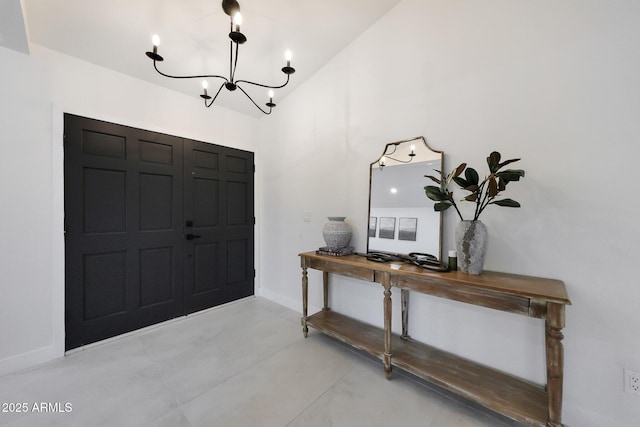 entryway with a notable chandelier