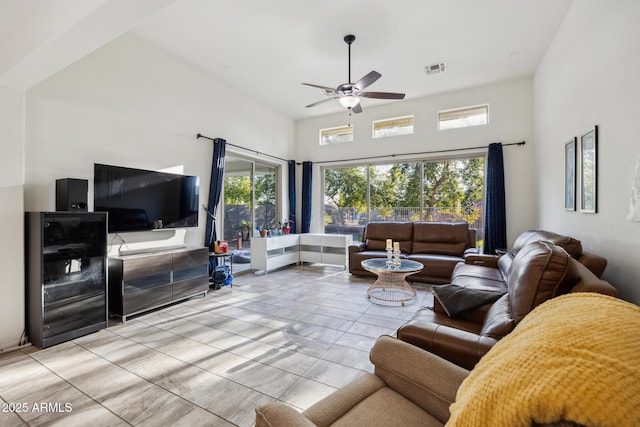 living room featuring ceiling fan and light tile patterned floors