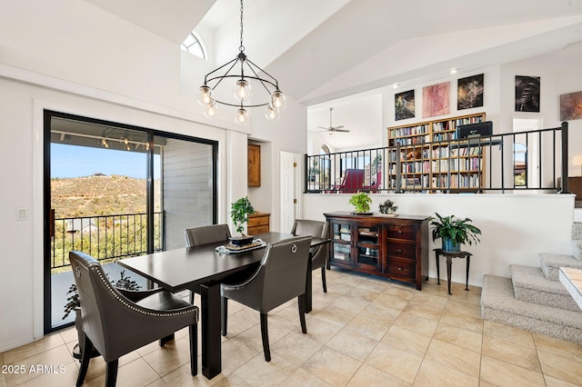 128 N French Dr, Prescott, AZ 86303 - dining area with vaulted ceiling, stairway, a ceiling fan, light tile patterned flooring, and a chandelier