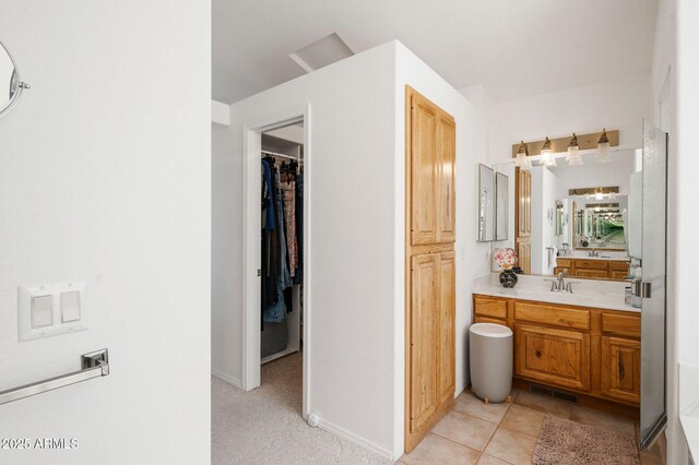 128 N French Dr, Prescott, AZ 86303 - bathroom with vanity, a spacious closet, and baseboards